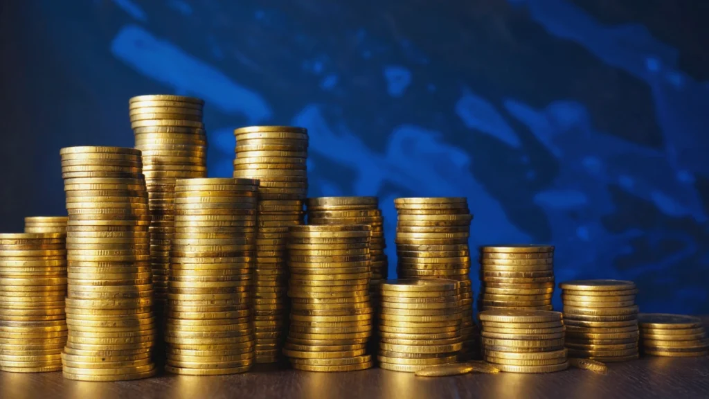 close-up of rare gold and silver coins being inspected for value and authenticity